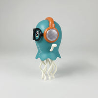 Blue dancing jellyfish toy with orange headphones, black glasses and white tentacles, shown from the side.
