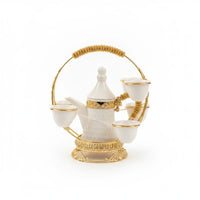 Trendiest traditional Arabic coffee set with white ceramic dallah, gold-tone accents, and ornate metal serving stand.