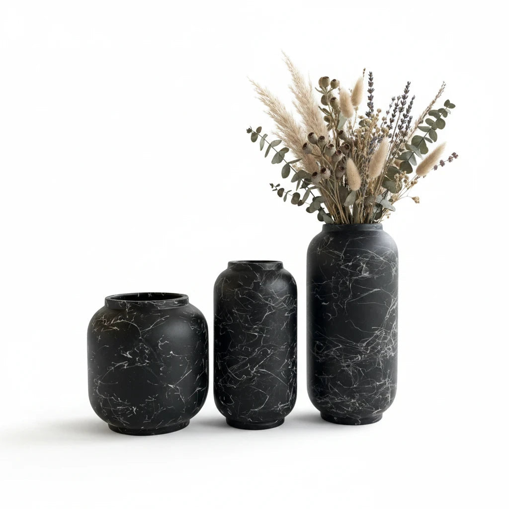Trendiest set of three matte black ceramic vases with white marble veining, styled with dried pampas grass and florals.