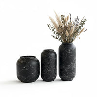 Trendiest set of three matte black ceramic vases with white marble veining, styled with dried pampas grass and florals.