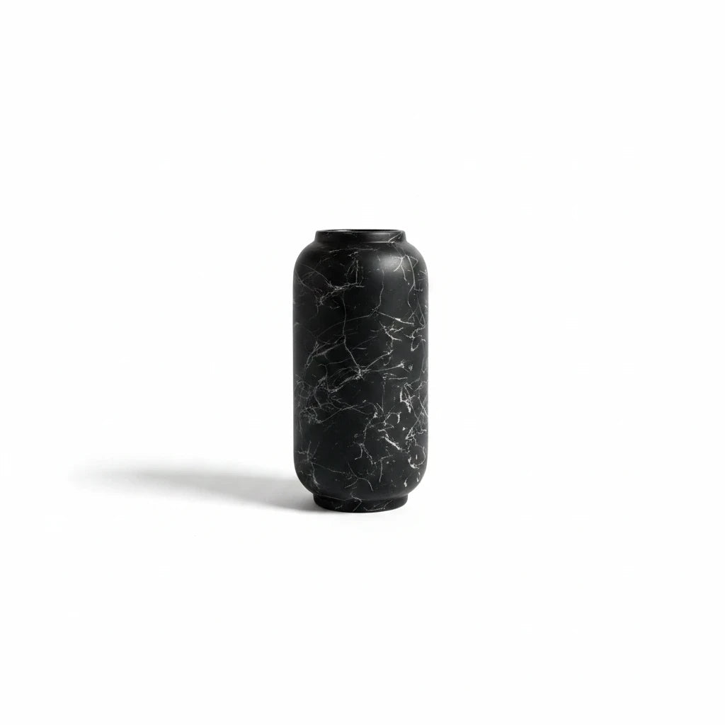 Trendiest ceramic vase with a matte black finish and white marble veining in a sleek cylindrical silhouette