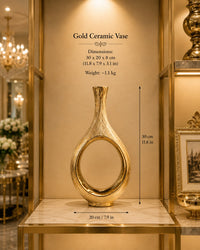 Trendiest brushed gold ceramic vase with a modern hollow circle design displayed on a marble shelf