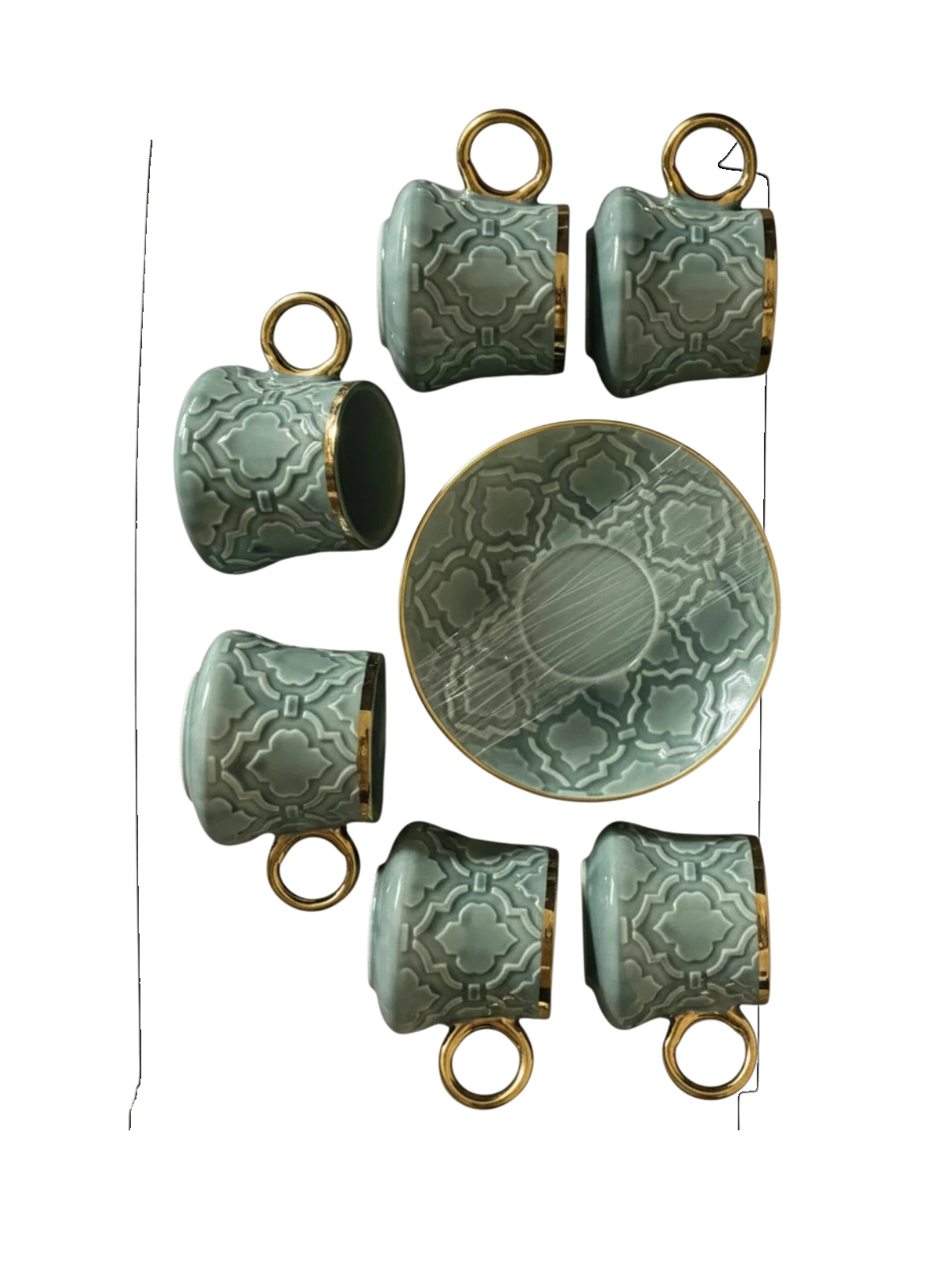 Trendiest ceramic coffee cup and saucer set in sage green with embossed geometric patterns and gold-tone rims.
