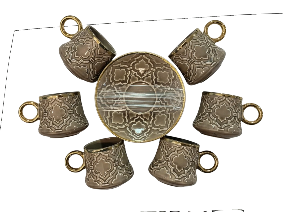 Trendiest ceramic coffee cup and saucer set with embossed geometric patterns and gold-tone rims in a gift box