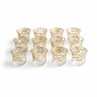 Trendiest decorative tea cup set featuring clear glass with intricate gold Arabic calligraphy detailing.