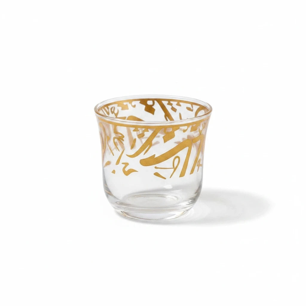 Trendiest clear glass tea cup featuring elegant gold Arabic calligraphy detailing for a luxurious table setting.