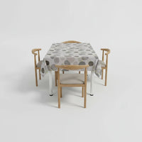 Trendiest rectangular dining table set with four chairs and a grey geometric circle patterned tablecloth