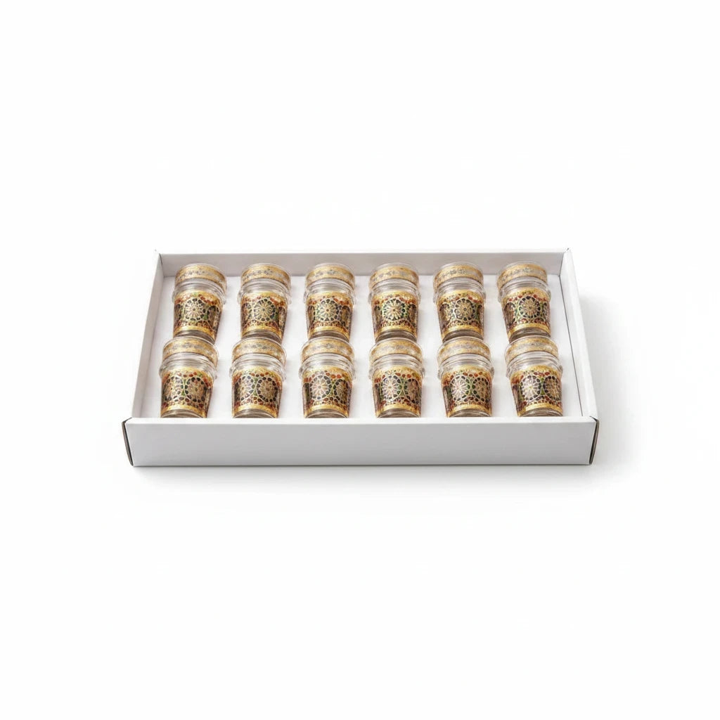 Trendiest set of 12 Moroccan tea glasses with gold detailing and colorful geometric patterns in a white gift box.