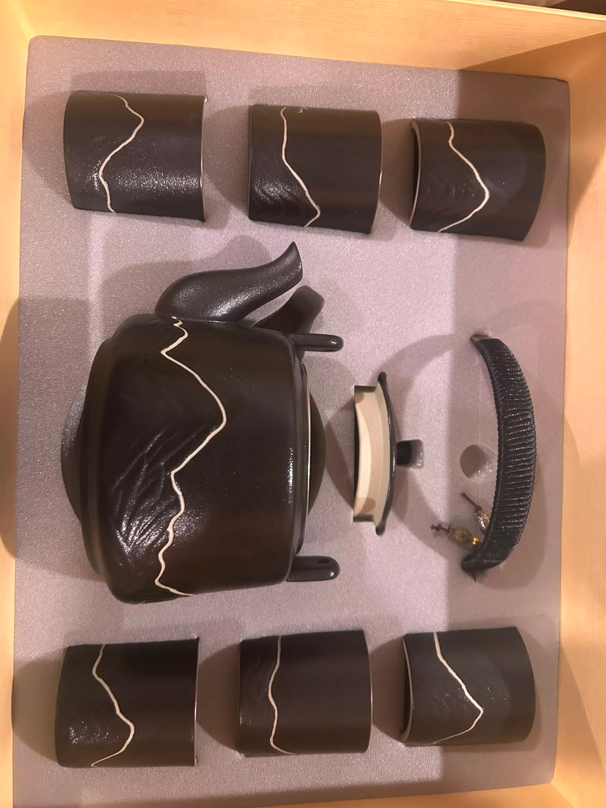 Trendiest high-fired black porcelain tea set with mountain motif, including a teapot and six matching cups in a box.