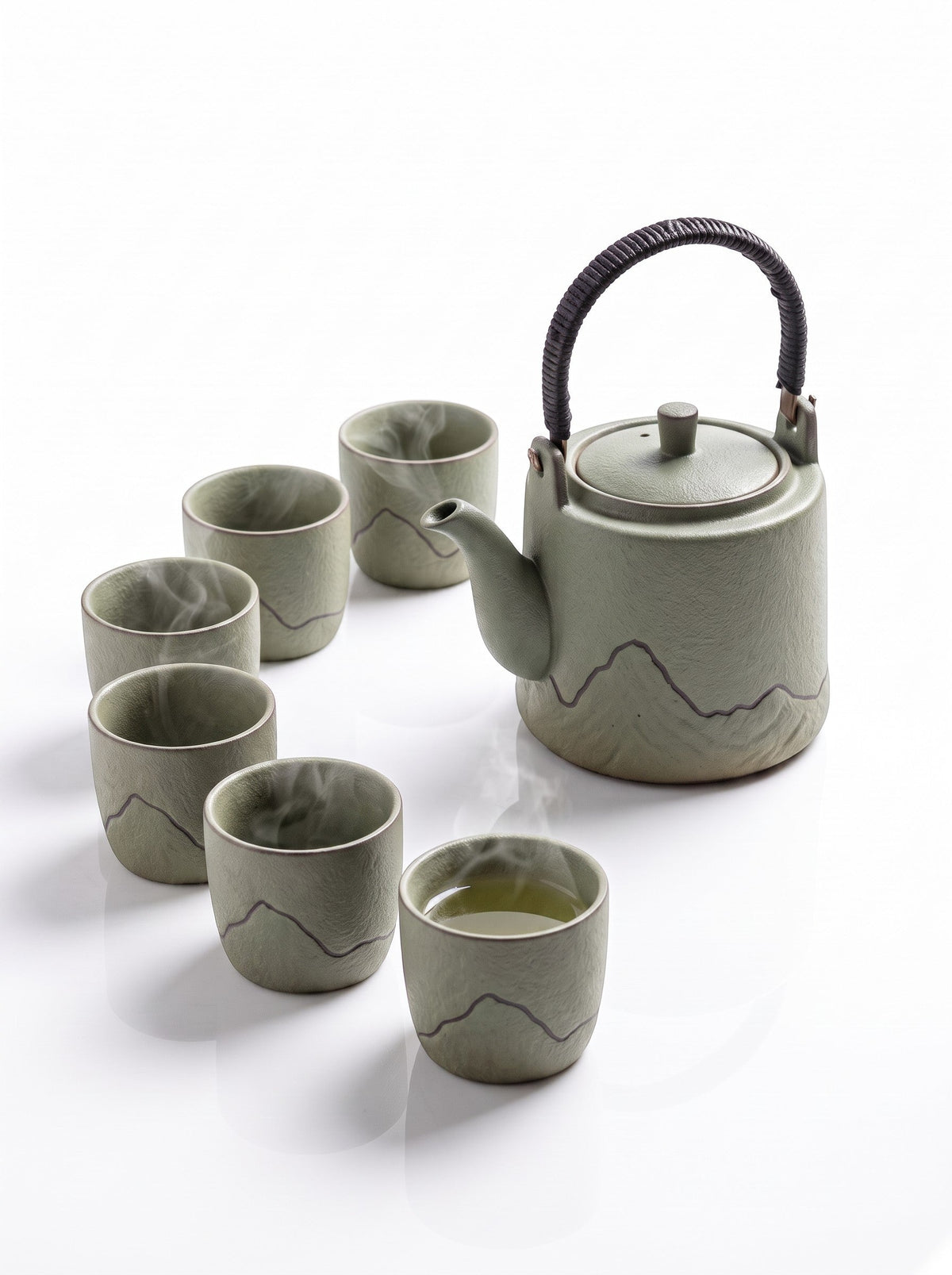Trendiest high-fired porcelain tea set in sage green with a mountain motif, including a teapot and six matching cups.