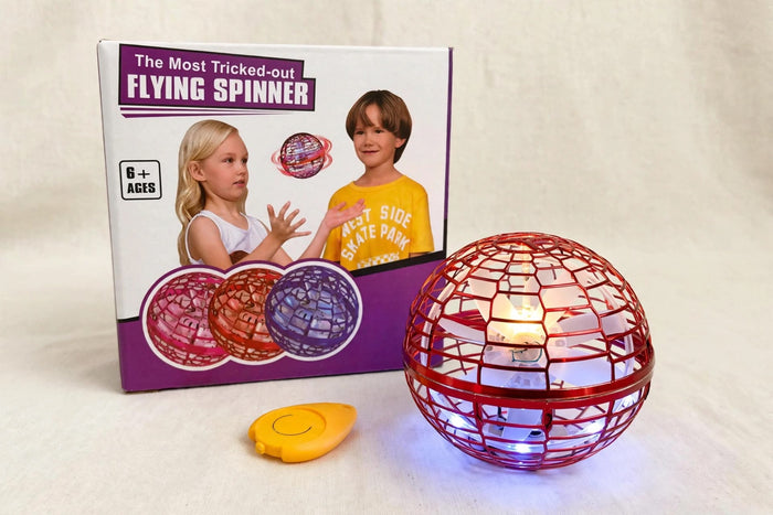 Trendiest interactive red flying spinner toy with LED lights and remote control next to its product packaging box