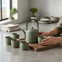 Trendiest traditional sage green porcelain tea set with teapot and six cups featuring a mountain motif on a tray