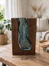 Trendiest handcrafted dark wood vase with a blue-tinted hand-blown glass insert, 25cm tall, on a rustic wooden table.