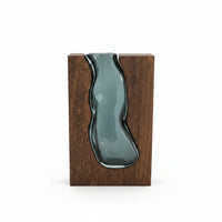 Trendiest handcrafted dark wood vase with a fluid blue-tinted hand-blown glass insert for floral arrangements.